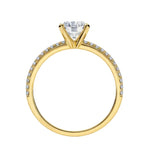 Side profile of the Round Infinity Pavé ring showing both intertwining pavé-set gold bands