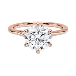 Round cut Moissanite lab grown diamond engagement ring round shank with a six claw setting, on a gold band, against a white background.Moissanite engagement ring cape town south africa grand diamonds ralph jacobs jeulia 