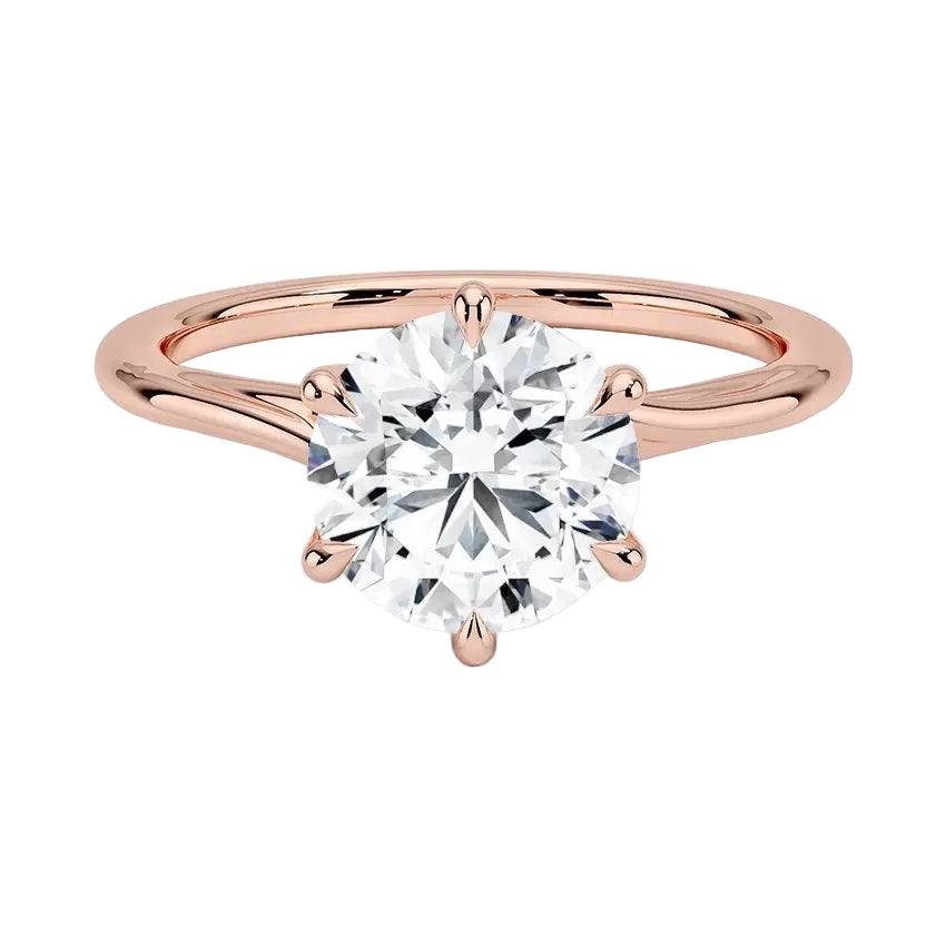 Round cut Moissanite lab grown diamond engagement ring round shank with a six claw setting, on a gold band, against a white background.Moissanite engagement ring cape town south africa grand diamonds ralph jacobs jeulia 