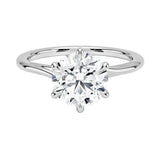 Close-up of a high-quality D-color VVS1 round brilliant moissanite on a shimmering pavé twisted shank.