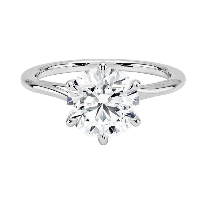 Close-up of a high-quality D-color VVS1 round brilliant moissanite on a shimmering pavé twisted shank.