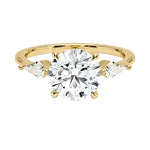 Luxury round brilliant moissanite engagement ring in yellow gold featuring structural kite cut side stone accents ApolloGem South Africa.