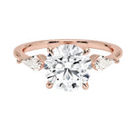 Luxury round brilliant moissanite engagement ring in rose gold featuring structural kite cut side stone accents ApolloGem South Africa.