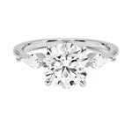 Luxury round brilliant moissanite engagement ring in white gold featuring structural kite cut side stone accents ApolloGem South Africa.
