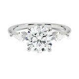 Luxury round brilliant moissanite engagement ring in white gold featuring structural kite cut side stone accents ApolloGem South Africa.