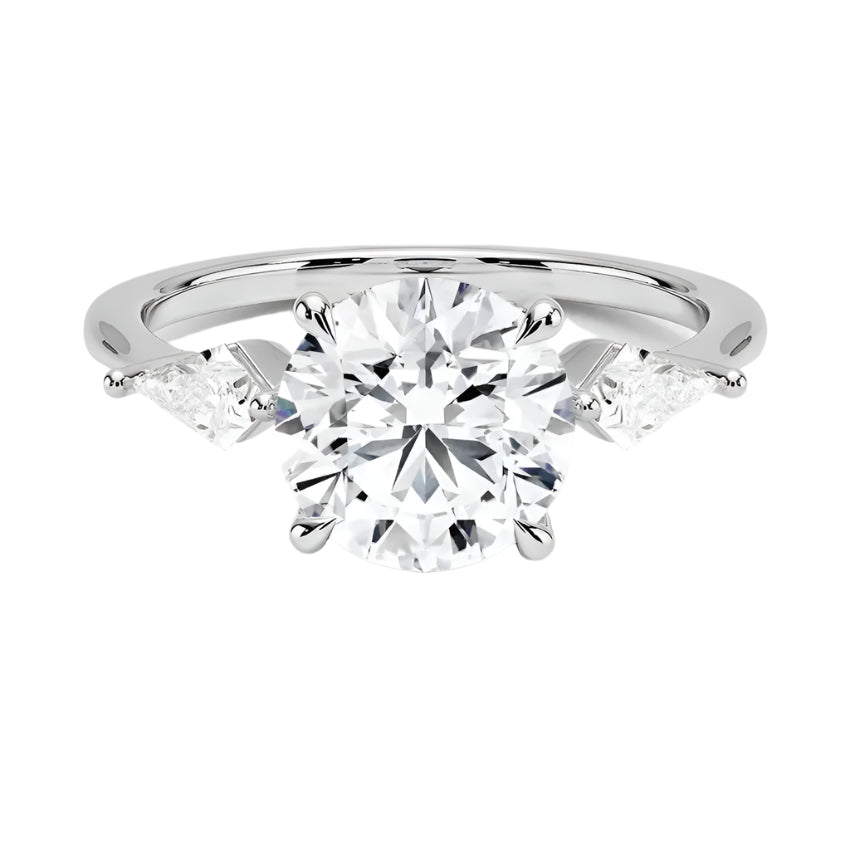 Luxury round brilliant moissanite engagement ring in white gold featuring structural kite cut side stone accents ApolloGem South Africa.