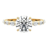 Luxury round brilliant moissanite engagement ring in yellow gold with an organic cluster of marquise side stones ApolloGem South Africa.