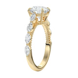 Detailed side view of a round moissanite ring showing the four-prong setting and unique marquise-cut side stone arrangement