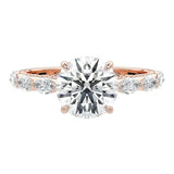 Close-up of a high-quality D-color VVS1 round brilliant moissanite center stone with asymmetrical accents guaranteed by a GRI certificate.
