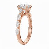 Unique bridal jewelry stack featuring a round cluster moissanite ring paired with a slim gold wedding band for a contemporary look