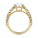 Top-down view of a round moissanite ring with floating side accents on a polished yellow gold comfort-fit shank.