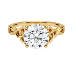 Luxury round brilliant moissanite engagement ring with an ornate infinity twisted band in yellow gold ApolloGem.
