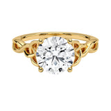 Luxury round brilliant moissanite engagement ring with an ornate infinity twisted band in yellow gold ApolloGem.