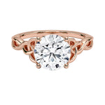 Luxury round brilliant moissanite engagement ring with an ornate infinity twisted band in rose gold ApolloGem.