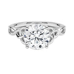 Luxury round brilliant moissanite engagement ring with an ornate infinity twisted band in white gold ApolloGem.