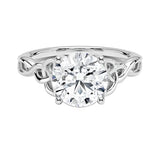 Luxury round brilliant moissanite engagement ring with an ornate infinity twisted band in white gold ApolloGem.