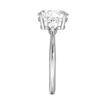 GRI certified round and pear moissanite ring in a signature ApolloGem premium LED-lit box for a luxury proposal.