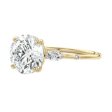 Dainty trilogy moissanite ring with leaf shaped side stones ApolloGem South Africa