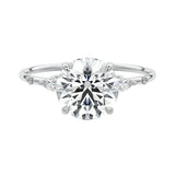 Six prong round moissanite ring with marquise accents and slim gold band