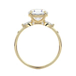 Gold ring with a diamond on a white background