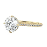 Side profile of the Round Royal Halo ring showing the clean solitaire basket and hidden halo
