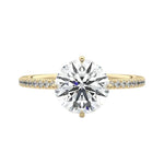 Secure four-claw cat-claw round brilliant moissanite ring with a hidden halo and pavé band in yellow gold ApolloGem