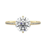 Secure four-claw cat-claw round brilliant moissanite ring with a hidden halo and pavé band in yellow gold ApolloGem