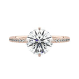 Secure four-claw cat-claw round brilliant moissanite ring with a hidden halo and pavé band in rose gold ApolloGem