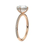 Top-down view of a D-color VVS1 round stone in a rose gold cat-claw pavé settin