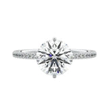 Secure four-claw cat-claw round brilliant moissanite ring with a hidden halo and pavé band in white gold ApolloGem