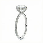 Top-down view of a D-color VVS1 round stone in a White gold cat-claw pavé settin