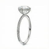 Top-down view of a D-color VVS1 round stone in a White gold cat-claw pavé settin
