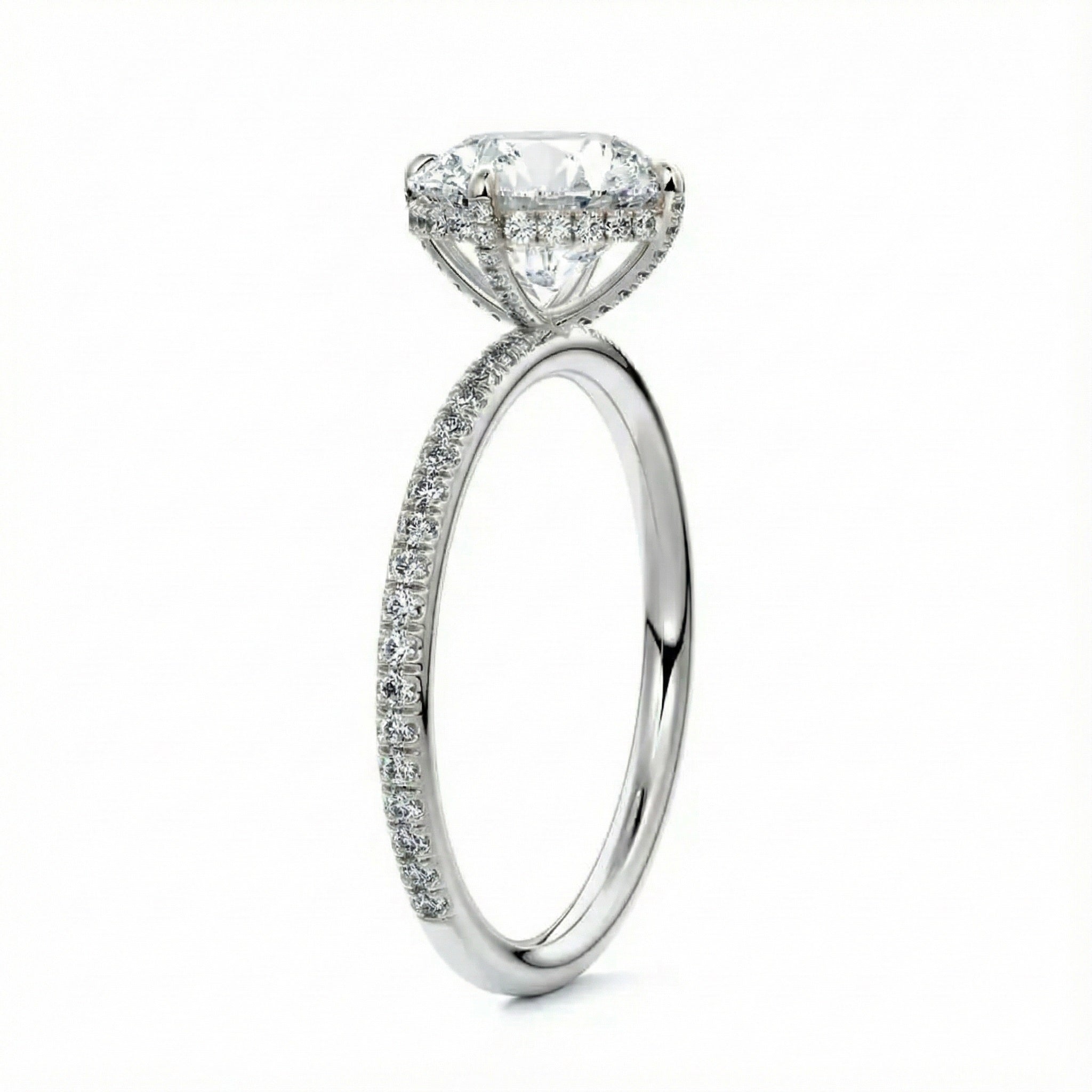 Top-down view of a D-color VVS1 round stone in a White gold cat-claw pavé settin