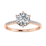 Royal six-prong round brilliant moissanite engagement ring with a pavé rose gold band ApolloGem.