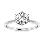 Royal six-prong round brilliant moissanite engagement ring with a pavé white gold band ApolloGem.