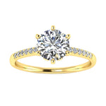 Royal six-prong round brilliant moissanite engagement ring with a pavé yellow gold band ApolloGem.