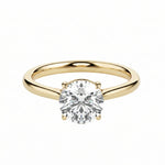 Classic round brilliant moissanite solitaire engagement ring in yellow gold ApolloGem.