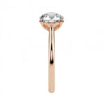 High-resolution side view showcasing the precision-engineered prongs and tapered gold band.