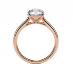 Symmetrical top-down view of a round moissanite solitaire in a polished solid gold setting.