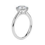 Detailed side view of the round solitaire showing the high-lift 4-prong crown architecture.
