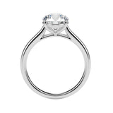 Symmetrical top-down view of a round moissanite solitaire in a polished solid gold setting.