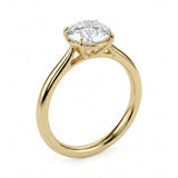 Detailed side view of the round solitaire showing the high-lift 4-prong crown architecture.
