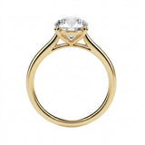 Symmetrical top-down view of a round moissanite solitaire in a polished solid gold setting.