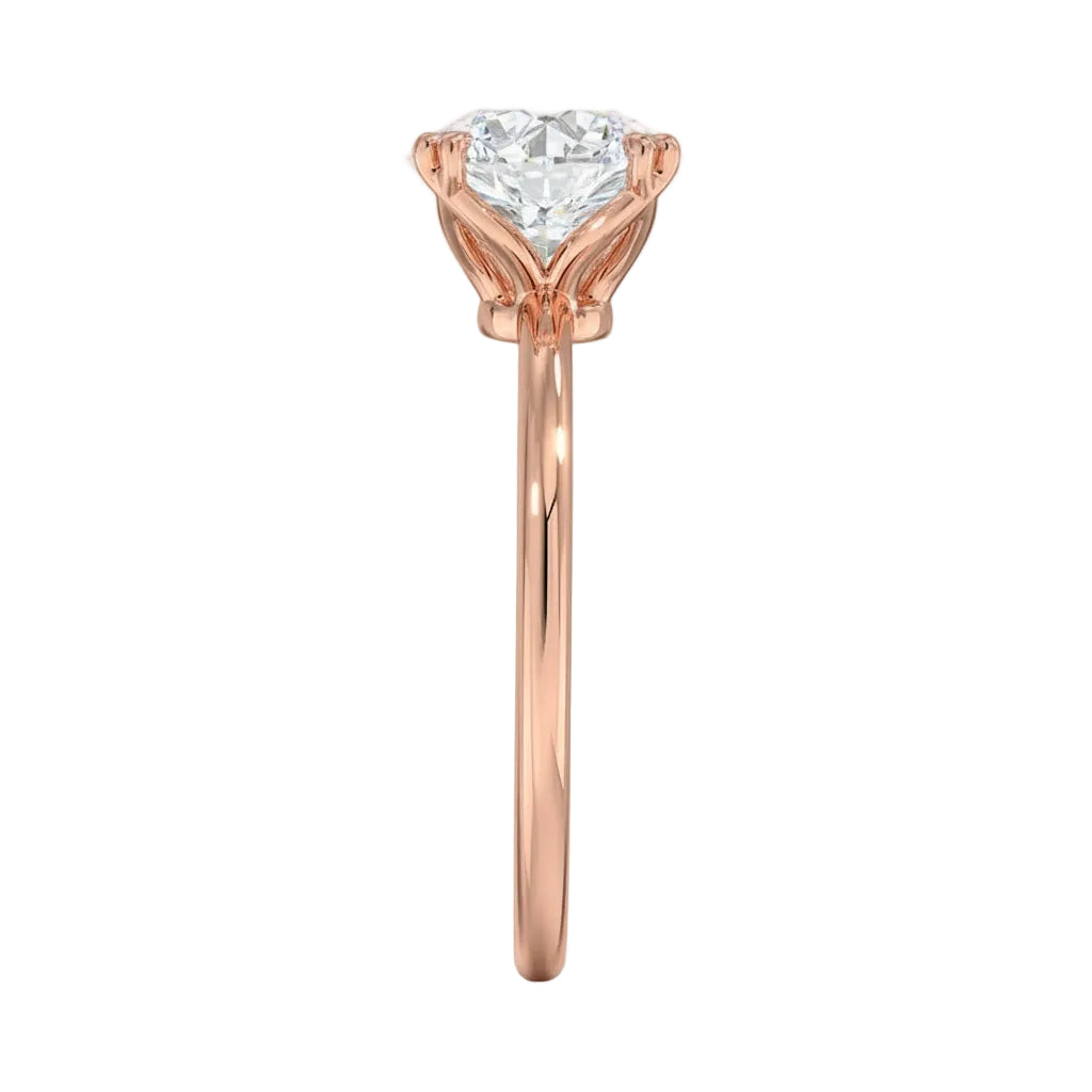 Symmetrical top-down view of a round moissanite solitaire in a secure rose gold setting.