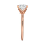 Symmetrical top-down view of a round moissanite solitaire in a secure rose gold setting.