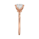 Symmetrical top-down view of a round moissanite solitaire in a secure rose gold setting.