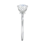 Symmetrical top-down view of a round moissanite solitaire in a secure white gold setting.