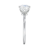 Symmetrical top-down view of a round moissanite solitaire in a secure white gold setting.
