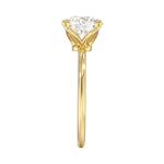 Symmetrical top-down view of a round moissanite solitaire in a secure yellow gold setting.