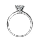 Symmetrical top-down view of a round moissanite solitaire in a polished 6-prong white gold setting.